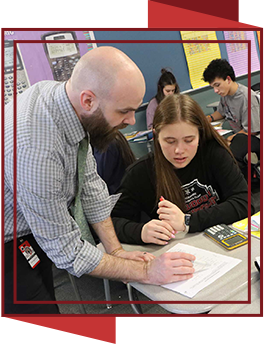 Teacher helping student