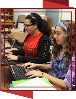 Two female students using laptop computers